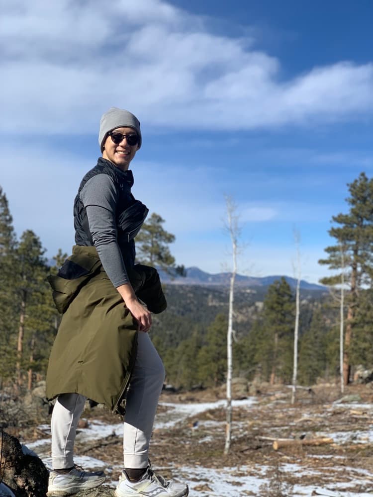 Douglas Wang hiking outdoors in the mountains